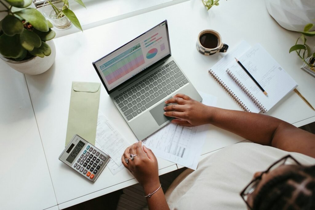 Small business professional working at a laptop while planning website improvements