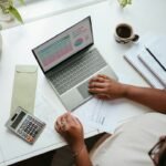 Small business professional working at a laptop while planning website improvements